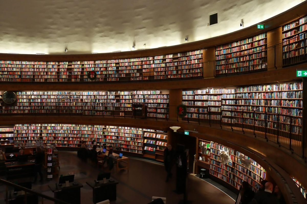 A vast collection of books lining the shelves of Stockholm's iconic public library.