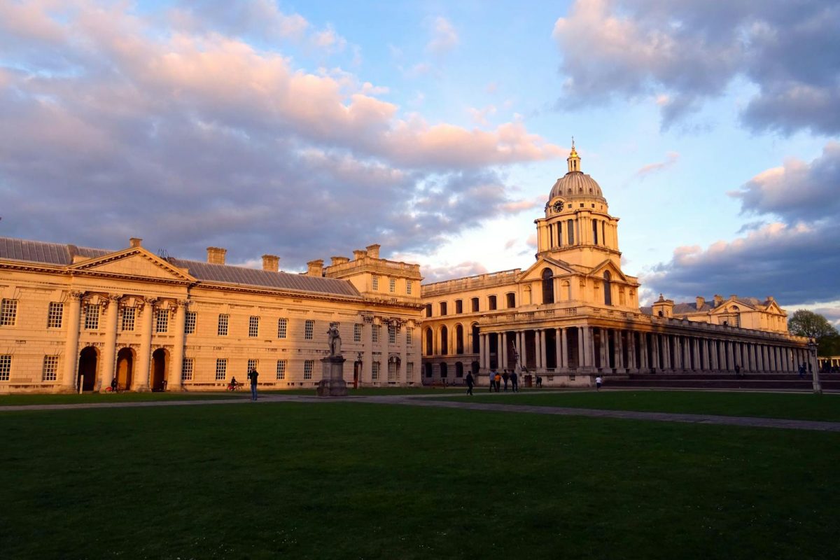 View of the Grand Greenwich architecture illuminated by sunset light with a dramatic sky.