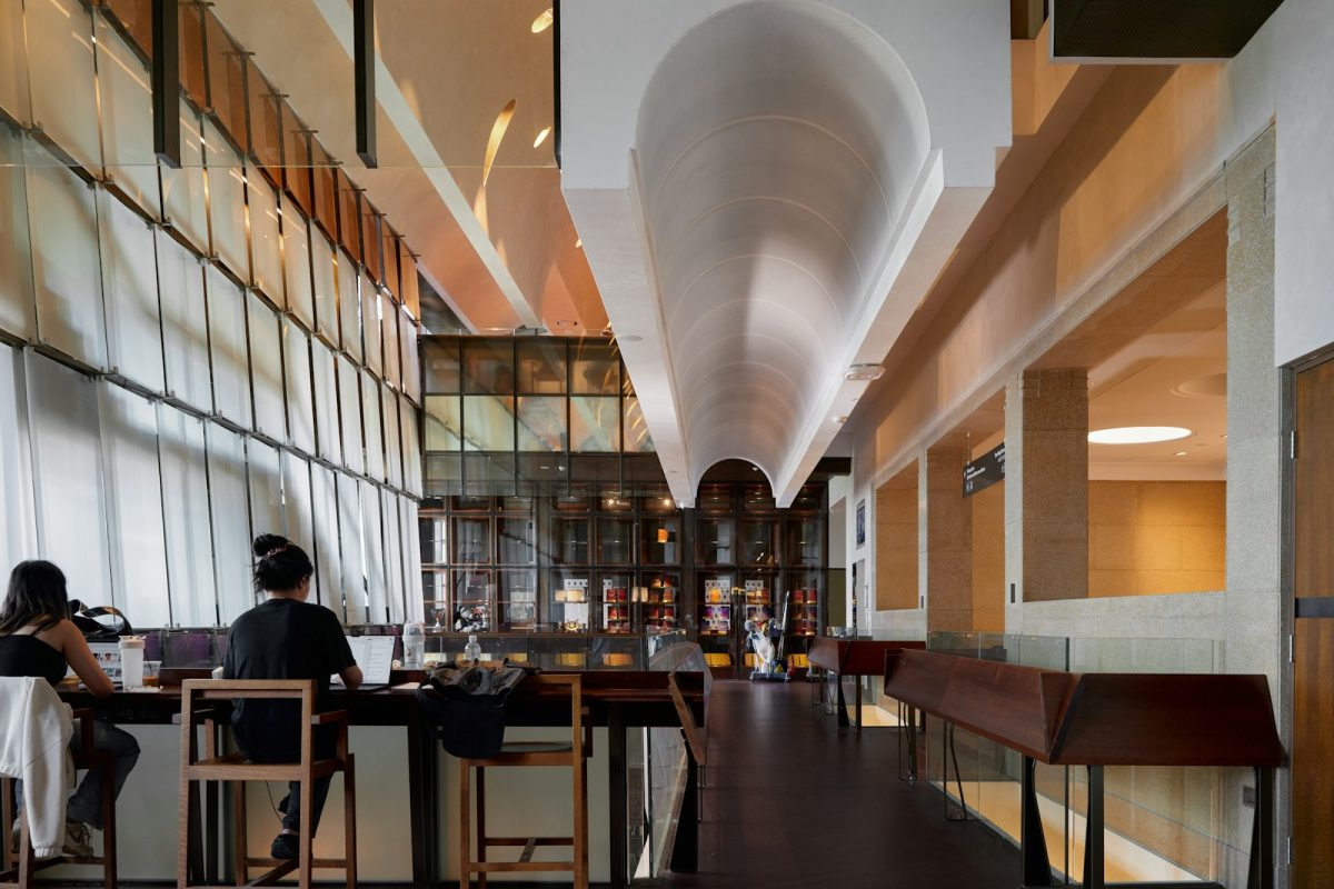 A couple of people sitting at a table in a restaurant