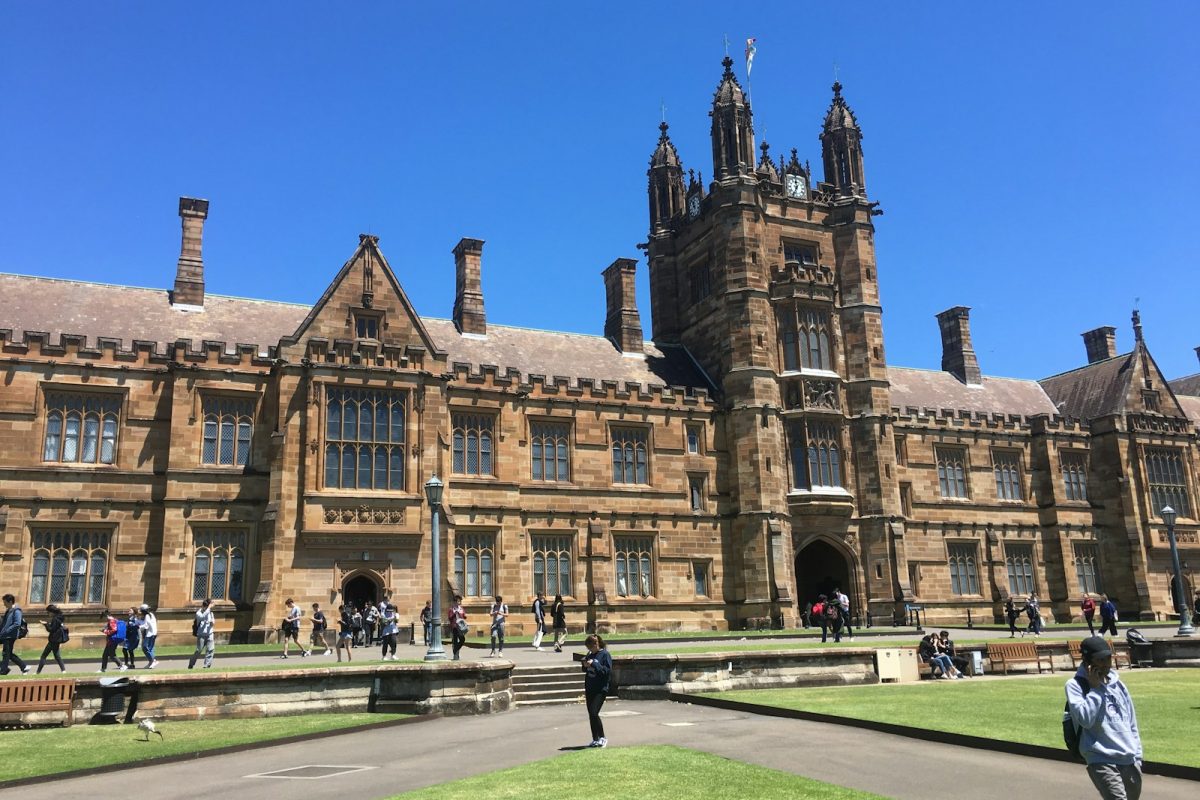 people walking near brown concrete building during daytime