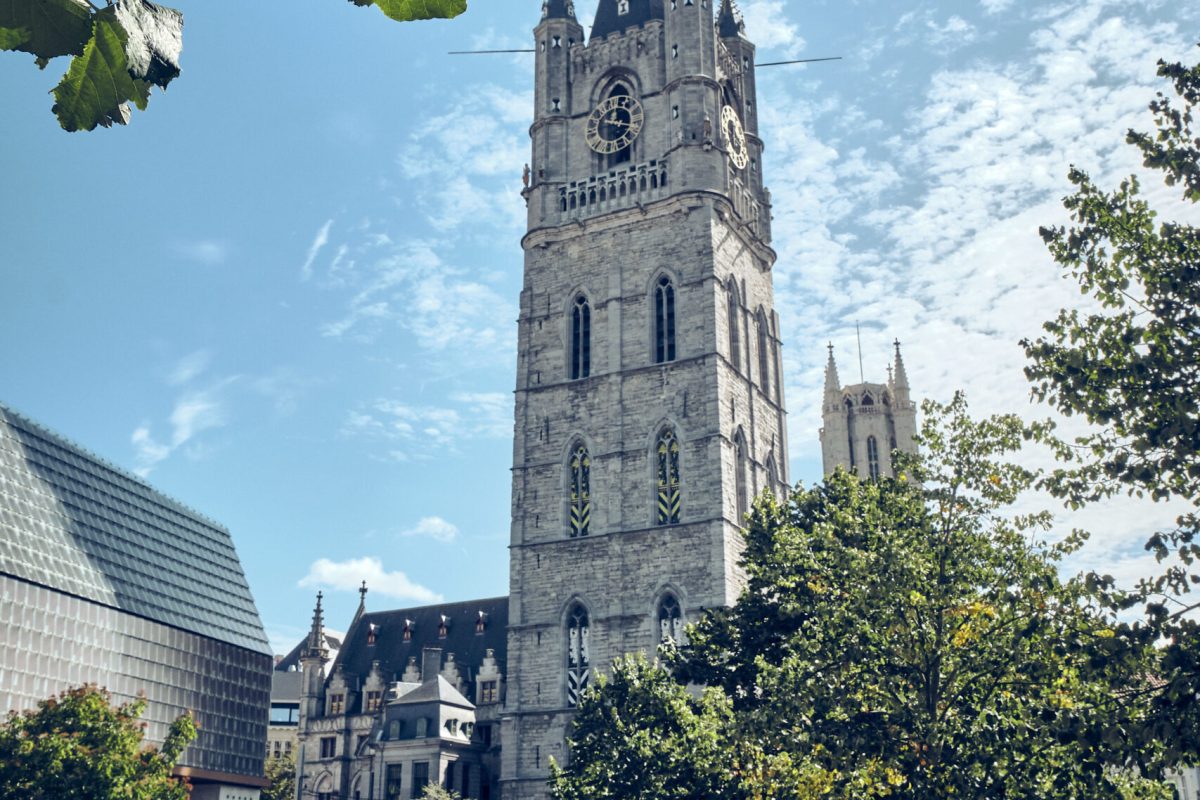 A vertical shot of a cathedral tower in Ghent, Belgium